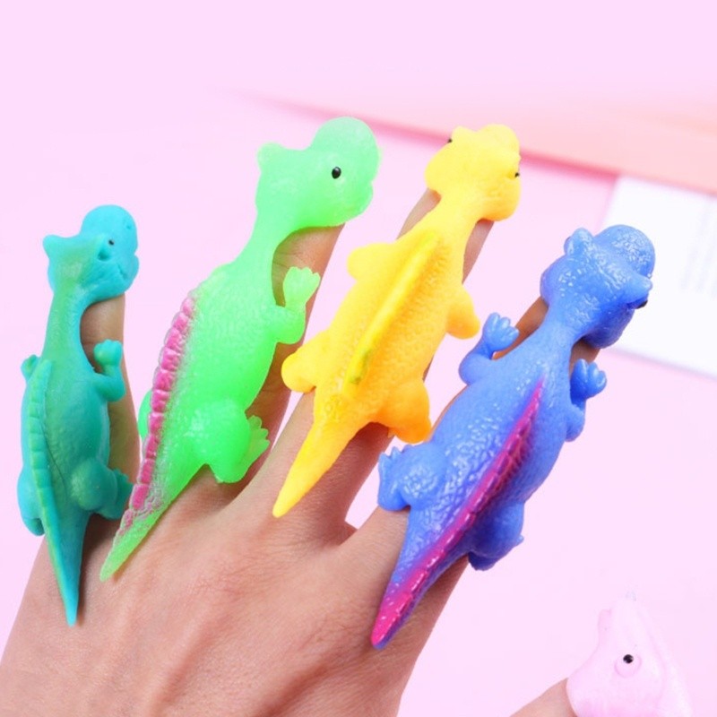 Jenniferae 10 ชิ้น TPR ไดโนเสาร์นิ้วมือ Slingshots ของเล่นสําหรับออทิสติกเด็ก Family Party Supply