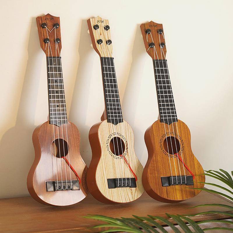 SPGH Kids 26/35cm 4 Strings กีตาร์ของเล่นดนตรีเพื่อการศึกษาพร้อม Paddles Hot