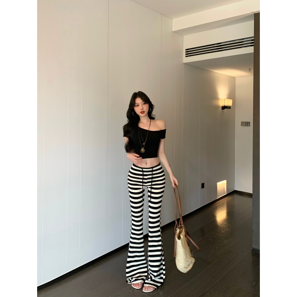 เสื้อยืดดีไซน์แบบอเมริกัน ทรงกระแทรกไหล่ สไตล์เพรียว จากผ้าฝ้าย พร้อมกางเกงขาสั้นลายเรียบๆ