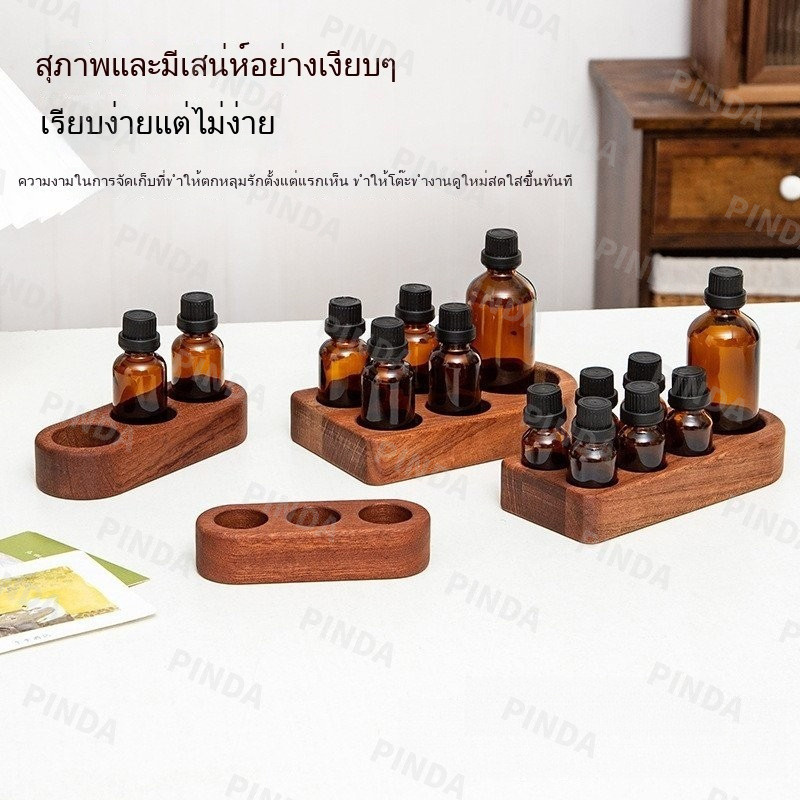 ฐานน้ํามันหอมระเหยไม้ยืนแสดงมีรูพรุนหลอดทดลองทดลองยืนขวดน้ํามันหอมระเหยฐานไม้เนื้อแข็งอโรมาฐาน