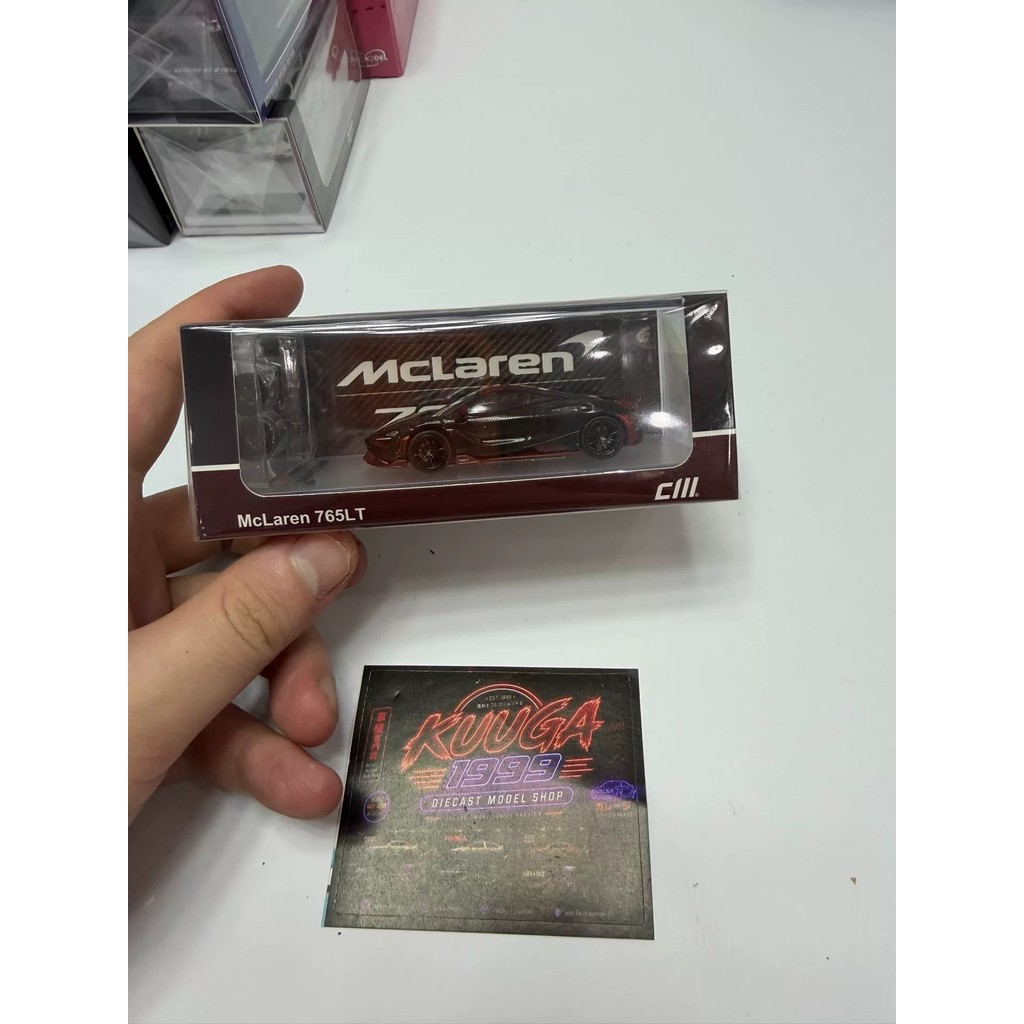 [พร้อม คลังสินค้ากําพร้า] ซม 1: 64 แม็คลาเรน 765LT สีดําสีน้ําตาลวัสดุโลหะผสมพร้อมกล่องเดิมอะไหล่ใหม