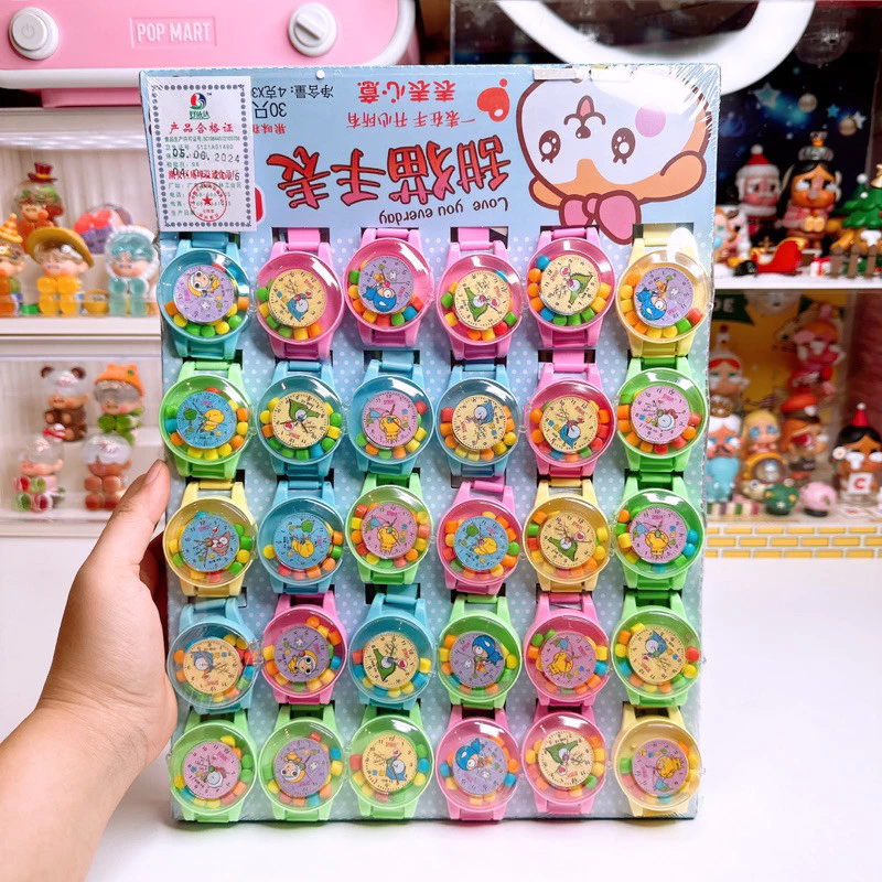 ลูกอมนาฬิกาข้อมือเป็นทั้งของเล่นเเละลูกอม [1 เเผง 30 ชิ้น]