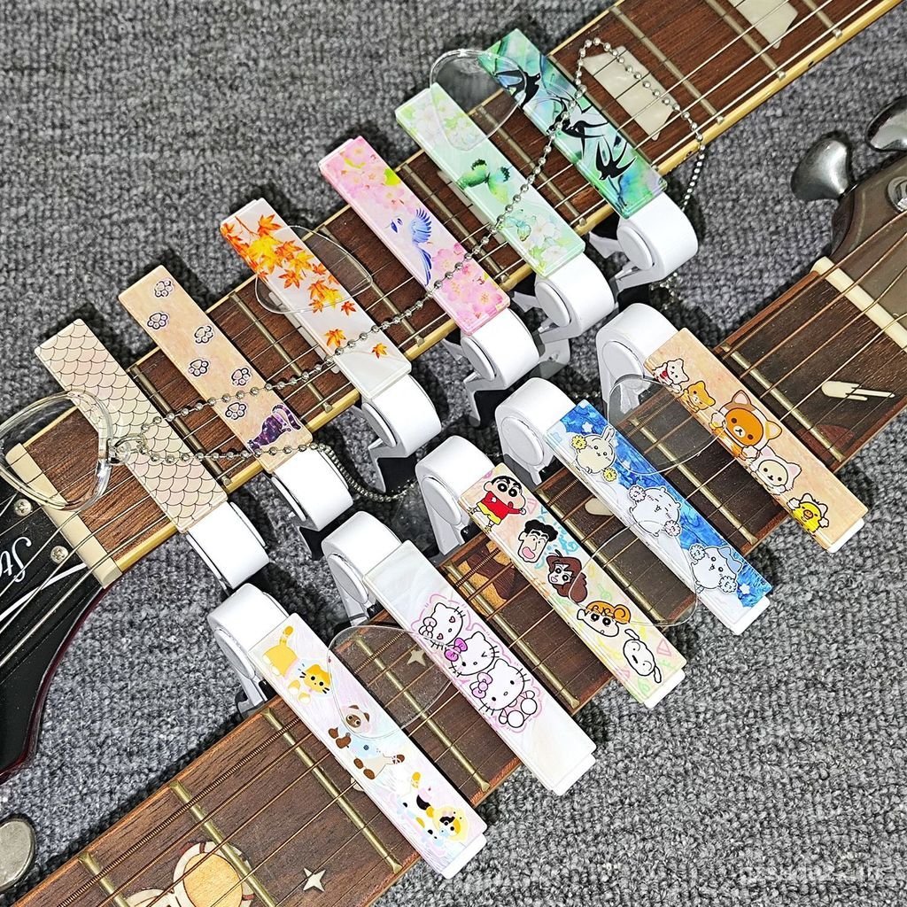 กีต้าร์โปร่งน่ารัก Capo กีต้าร์โปร่งไฟฟ้า Ukulele Capo Tuner การ์ตูน Voice Capo VEHV
