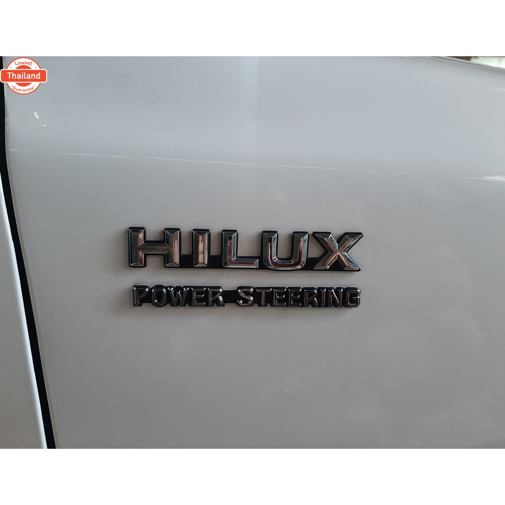 โลโก้ HILUX POWER-STEERING  โลโก้ไฮลักษ เพาเวอร์ ติดข้างแก้ม สีชุ-ดำ งานเทีย โตโยต้า HILUX MIGHTY-X 