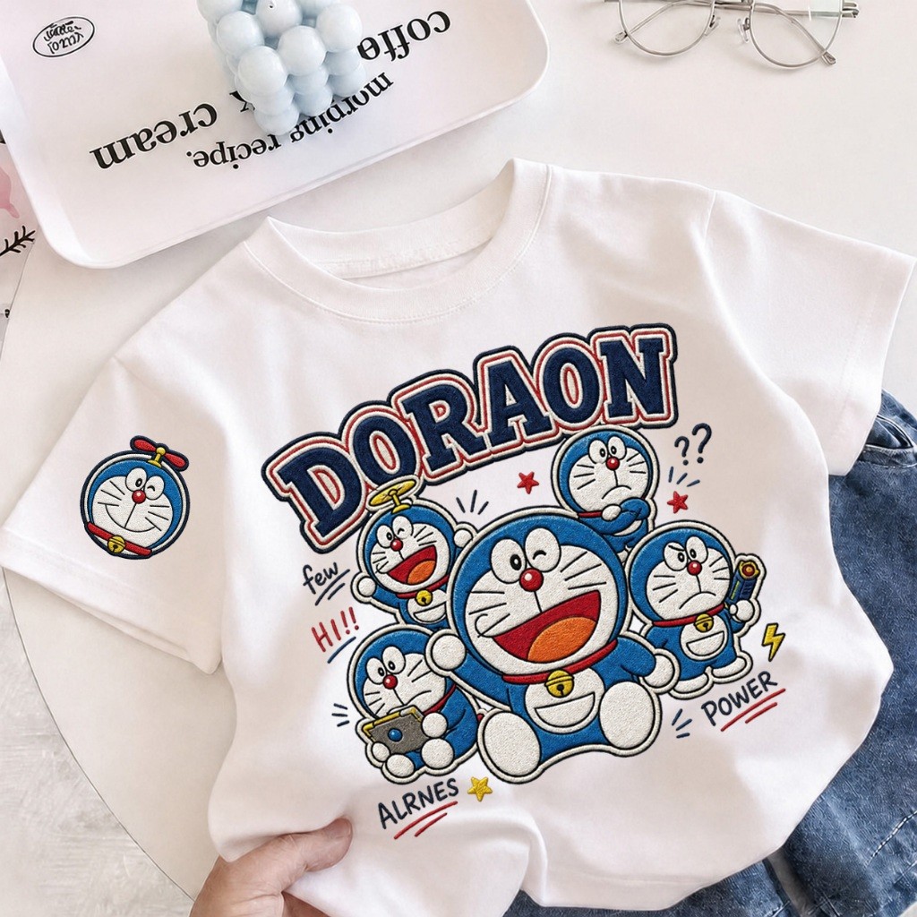 【จัดส่งภายใน 24 ชม.】เสื้อยืดเด็กแขนสั้น COD โดราเอมอน ผ้า Sorona ลายการ์ตูนน่ารัก นุ่ม ระบายอากาศดี ใส่สบาย