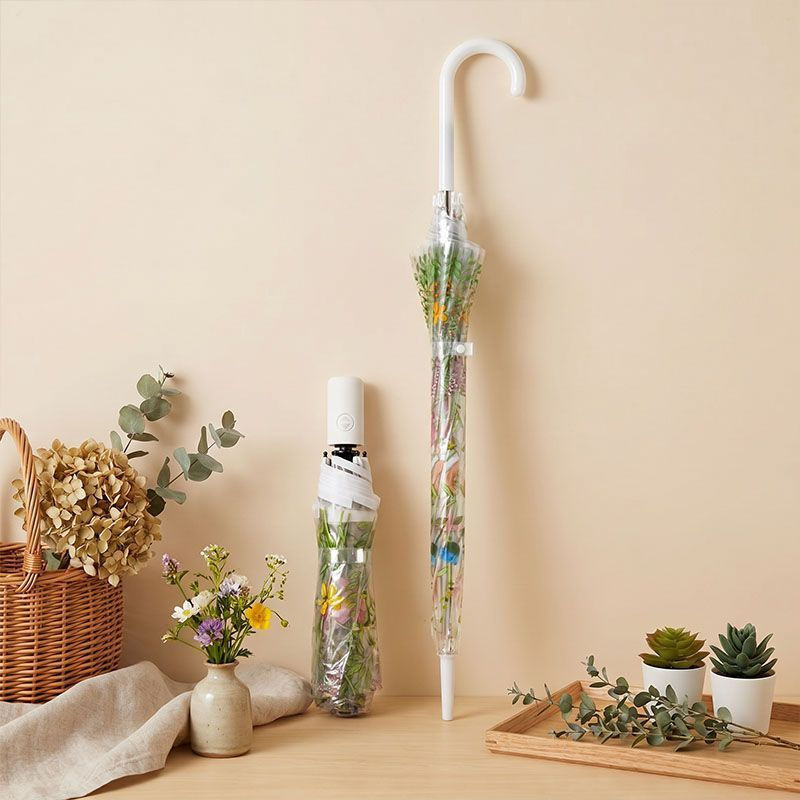 The transparent long-handled manual folding umbrella for students, which is a must-have item for out