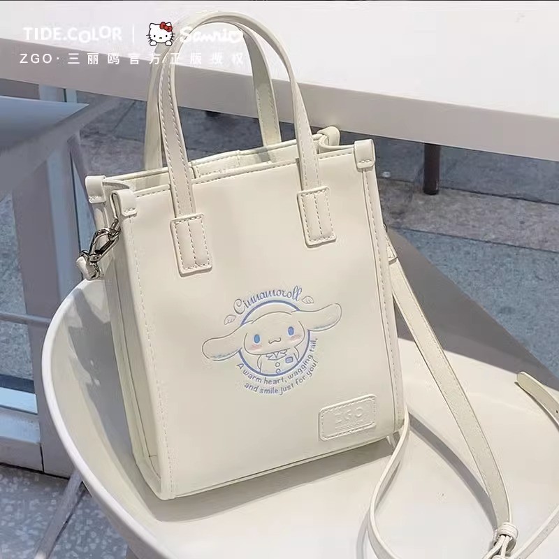 กระเป๋าสะพายไหล่และถือ ZGO Zhenggang Sanrio สำหรับสตรี ออกแบบโดย Hello Kitty