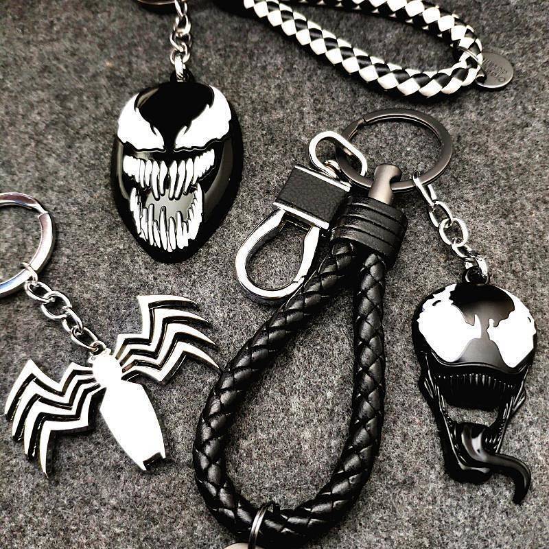 Venom อุปกรณ์ต่อพ่วงพวงกุญแจ Venom Spiderman โลโก้โลหะพวงกุญแจรถกระเป๋านักเรียนเอวจี้ Niche