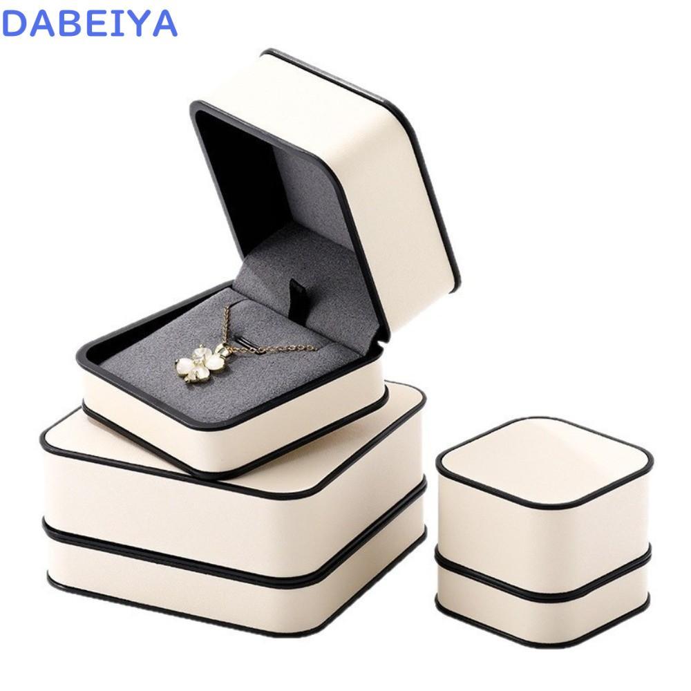 กล่องแหวน DABEIYA, กล่องต่างหูระดับไฮเอนด์สีเบจ, กล่องสร้อยคอออกแบบกรอบสีดํา PU บุกํามะหยี่