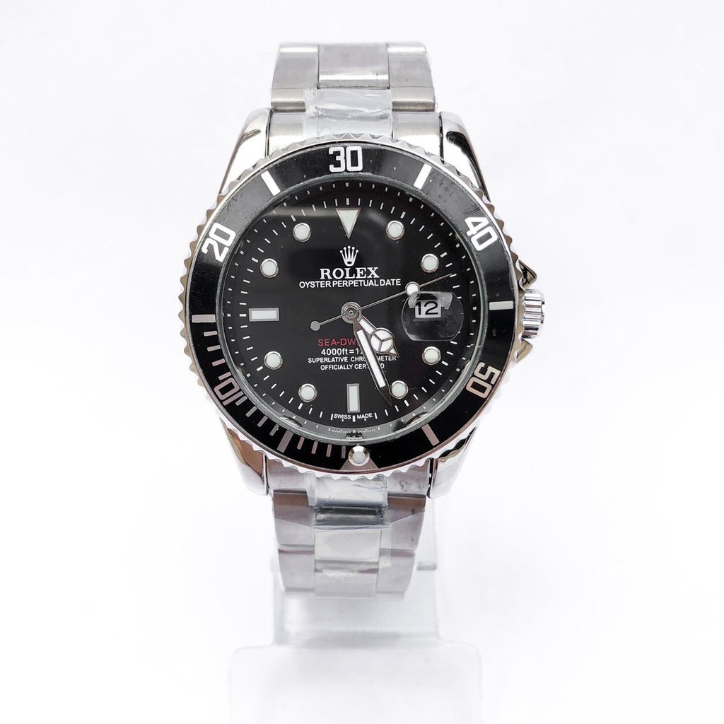 นาฬิกา Rolex สีเงินกับผู้ชายเรือดําน้ําสีเขียวหรือสีดําหรูหรา