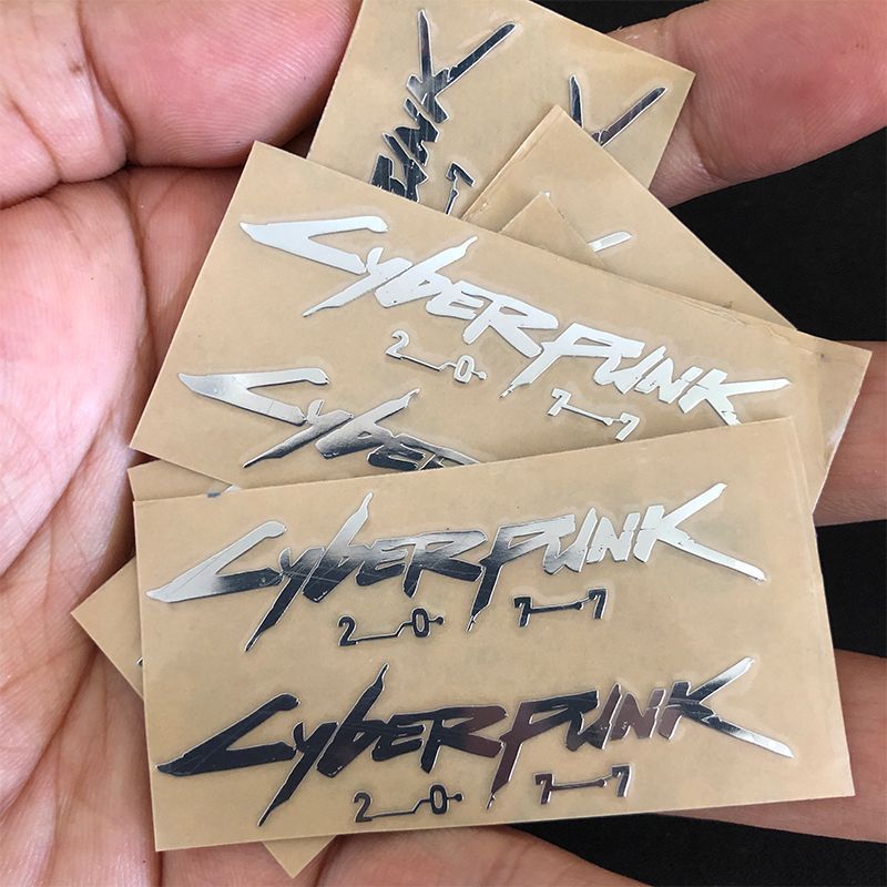 Cyberpunk Cyberpunk2077 สติ๊กเกอร์โลหะแล็ปท็อปแท็บเล็ตกีตาร์หมวกกันน็อคสติกเกอร์ตกแต่ง X0115