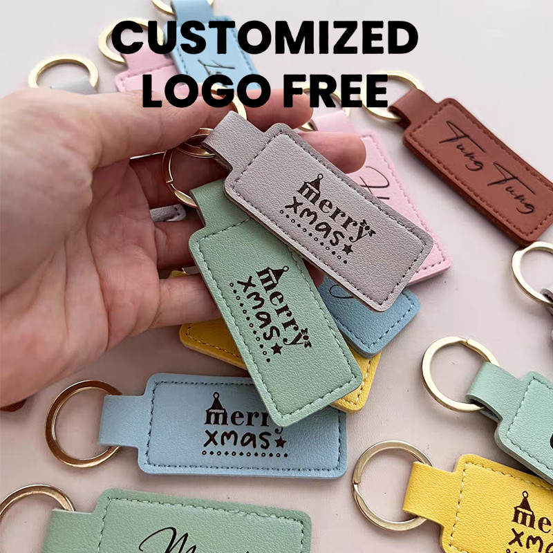 Free โลโก้ที่กําหนดเองPU พวงกุญแจหนังแกะสลักชื่อธุรกิจอุปกรณ์เสริม DIY แขวนกระเป๋าเครื่องประดับสามารถพิมพ์ด้วยสโลแกนหรือโลโก้นักเรียนของขวัญที่ระลึก