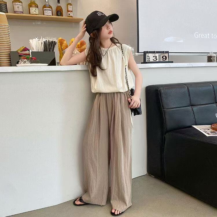 ปลาค็อด 2026สาวแขนกุด2025ฤดูร้อนสไตล์ใหม่กลางเด็กใหญ่หลวมลายกางเกงขากว้างแฟชั่นทุกการแข่งขันสองชิ้นอ