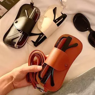 【กรุงเทพจัดส่งสินค้า】กระเป๋าใส่แว่นตาสไตล์ใหม่ กระเป๋าเก็บแว่นตาหนัง PU กระเป๋าใส่แว่นตาเชือกเส้นเล็ก