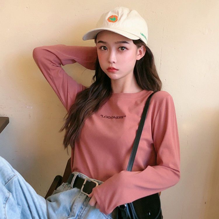2026 แฟชั่น 20262024ฤดูใบไม้ร่วงใหม่สไตล์เกาหลีรุ่นรอบคอตัวอักษรหลวม All-Match เสื้อยืดแขนยาวผู้หญิง