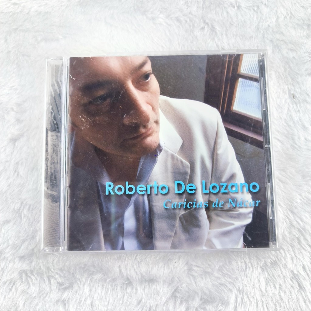 X038 เสื้อคลุม De Lozano caricias CD Import C0103