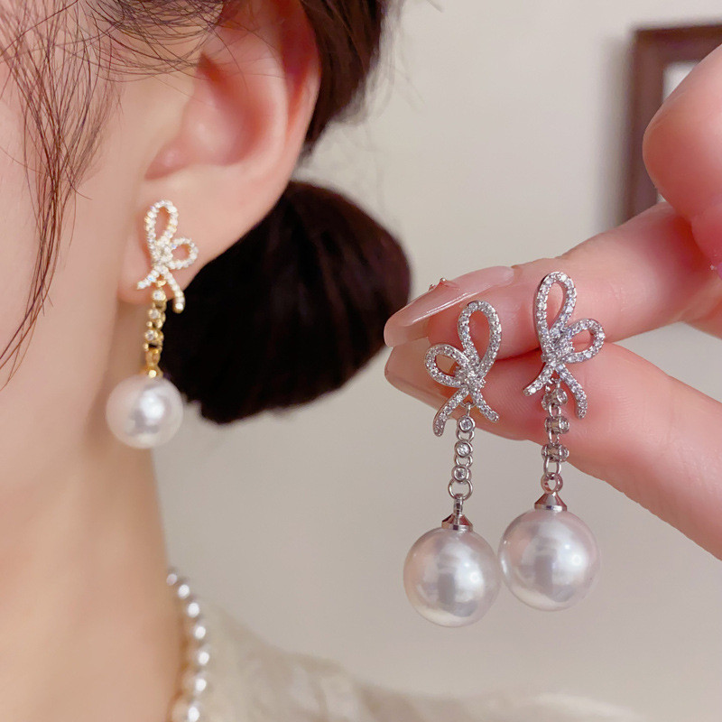 ส925 เงินเข็มอ่อนโยนเพทายโบว์มุกพู่ต่างหูแฟชั่นที่สวยหรูขายส่ง