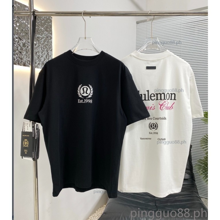 เสื้อยืดแขนสั้นฤดูร้อนใหม่ทําจากผ้าฝ้ายแท้พร้อมโลโก้ตัวอักษรพิมพ์คอกลมหลวมสําหรับผู้ชายและผู้หญิง