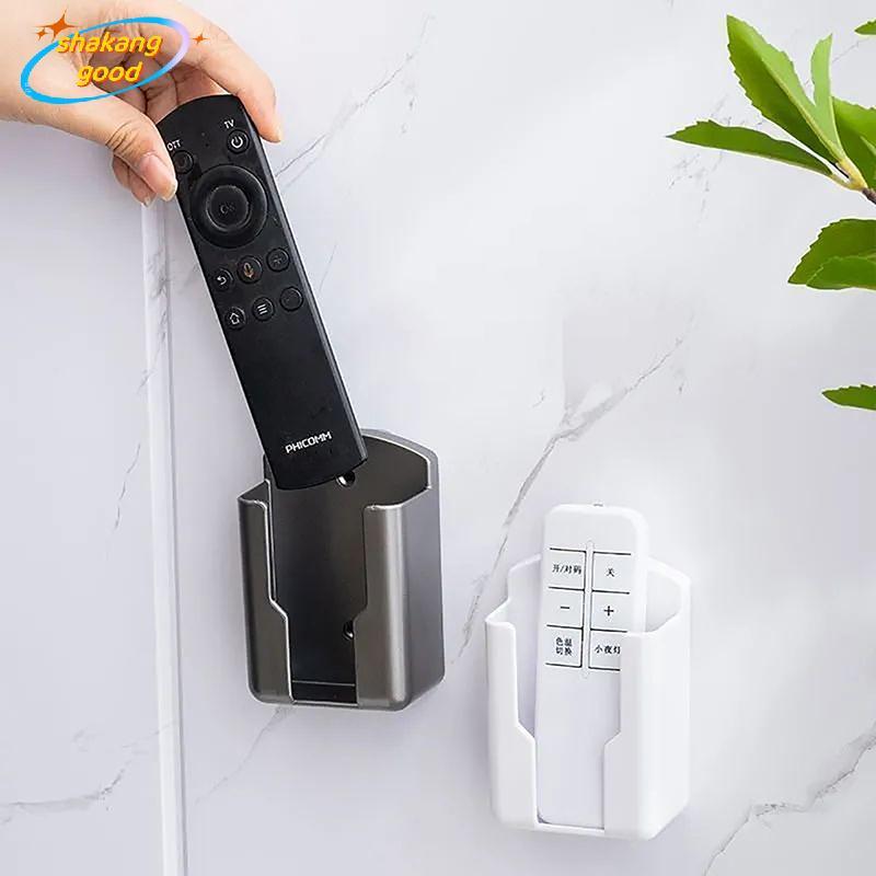 SKTH Universal ที่วางรีโมทคอนโทรลโทรศัพท์ชาร์จ Braet เครื่องปรับอากาศรีโมทคอนโทรล Braet ชั้นวางติดผนังขาตั้ง SKK