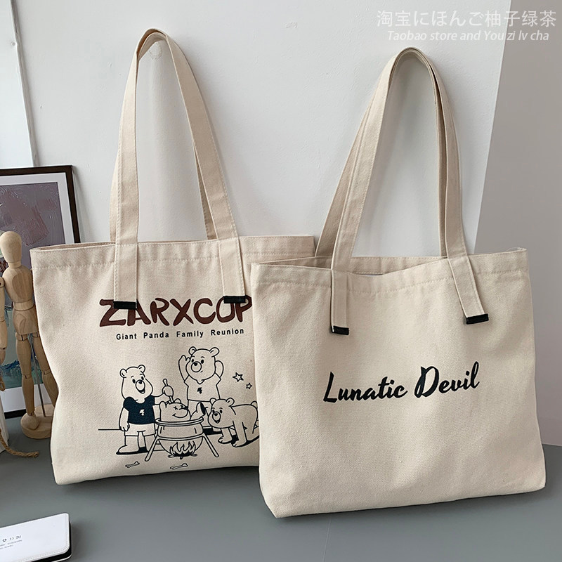 gental women กระเป๋า gentlewom กระเป๋าผ้าใบ Letter Large Summer Niche Style Satchel One-Shoulder Can