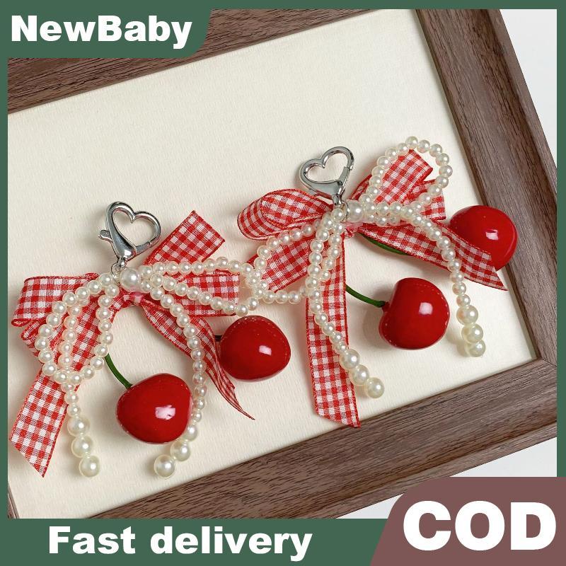 NEWBABY เชอร์รี่ลายสก๊อต Bowknot พวงกุญแจเพิร์ลลูกไม้ Charm จี้พวงกุญแจเครื่องประดับสําหรับสาวผู้หญิงของขวัญกระเป๋าตกแต่ง TH