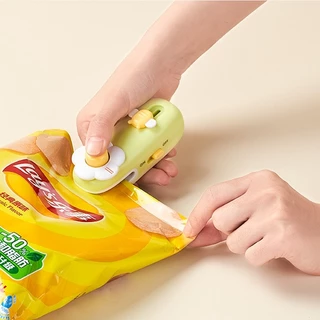 เครื่องซีลถุง 2in1 เครื่องซีลปากถุง เครื่องซีลถุงพลาสติก แบบพกพา มีใบมีดตัด แม่เหล็กติดตู้เย็น ถนอมอาหาร