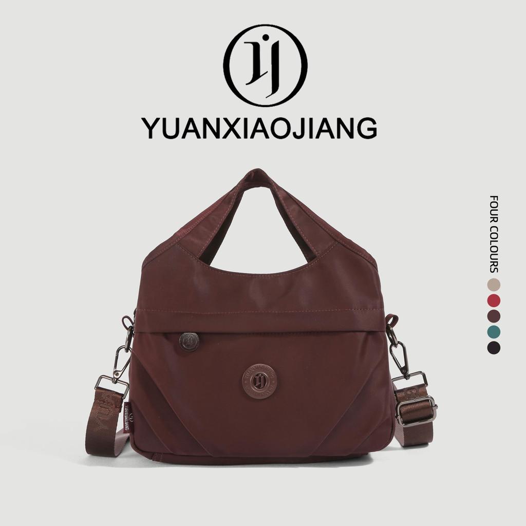 YUANXIAOJIANG กระเป๋าสะพายเฉียง รุ่นใหม่ ดีไซน์มัลติฟังก์ชัน ผ้าไนลอนกันน้ำ ถือได้สะพายไหล่ได้ แฟชั่นทันสมัย