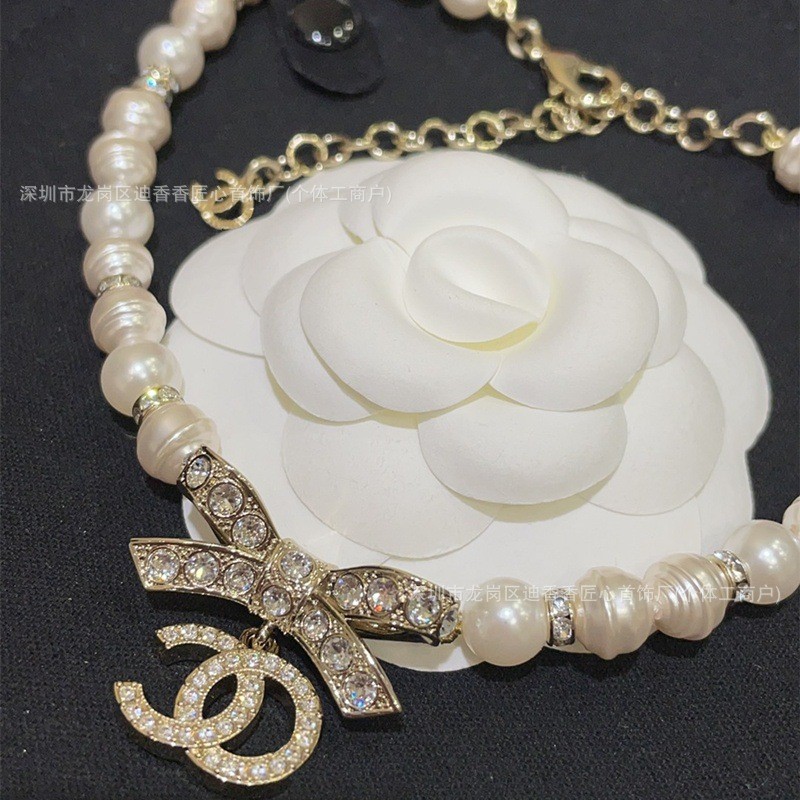 สร้อยคอมุกลight gold bow clavicle chain สไตล์คนดัง classy