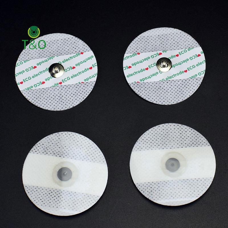 T&O 50 ชิ้นทิ้ง ECG Electrodes Medical Electrode Patch EKG อุปกรณ์เสริมไม่ทอ ECG Electrode แผ่นผ้าไม