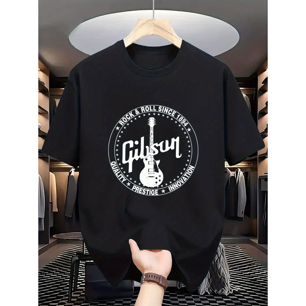 ทีเชิ้ตกราฟิกสีดำสำหรับผู้ชาย ลายกีตาร์ ผ้าฝ้าย ระบายอากาศได้ดีและมีสไตล์ เหมาะสำหรับงานเทศกาลดนตรี
