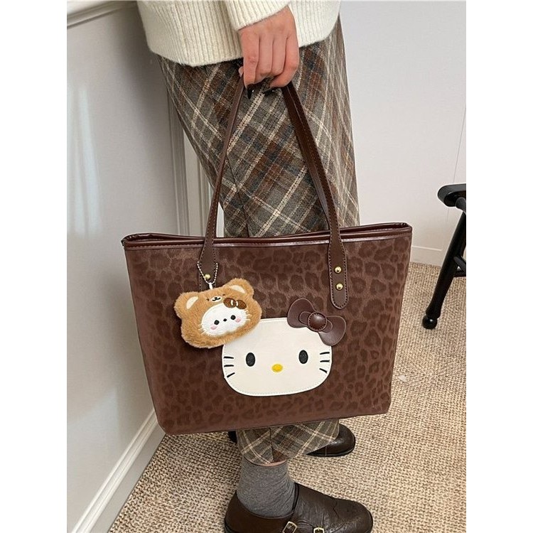 เวอร์ชั่นเกาหลีเสือดาวพิมพ์Hello Kittyกระเป๋าสะพายหญิงความจุขนาดใหญ่การ์ตูนน่ารักแบบพกพาToteกระเป๋าเ