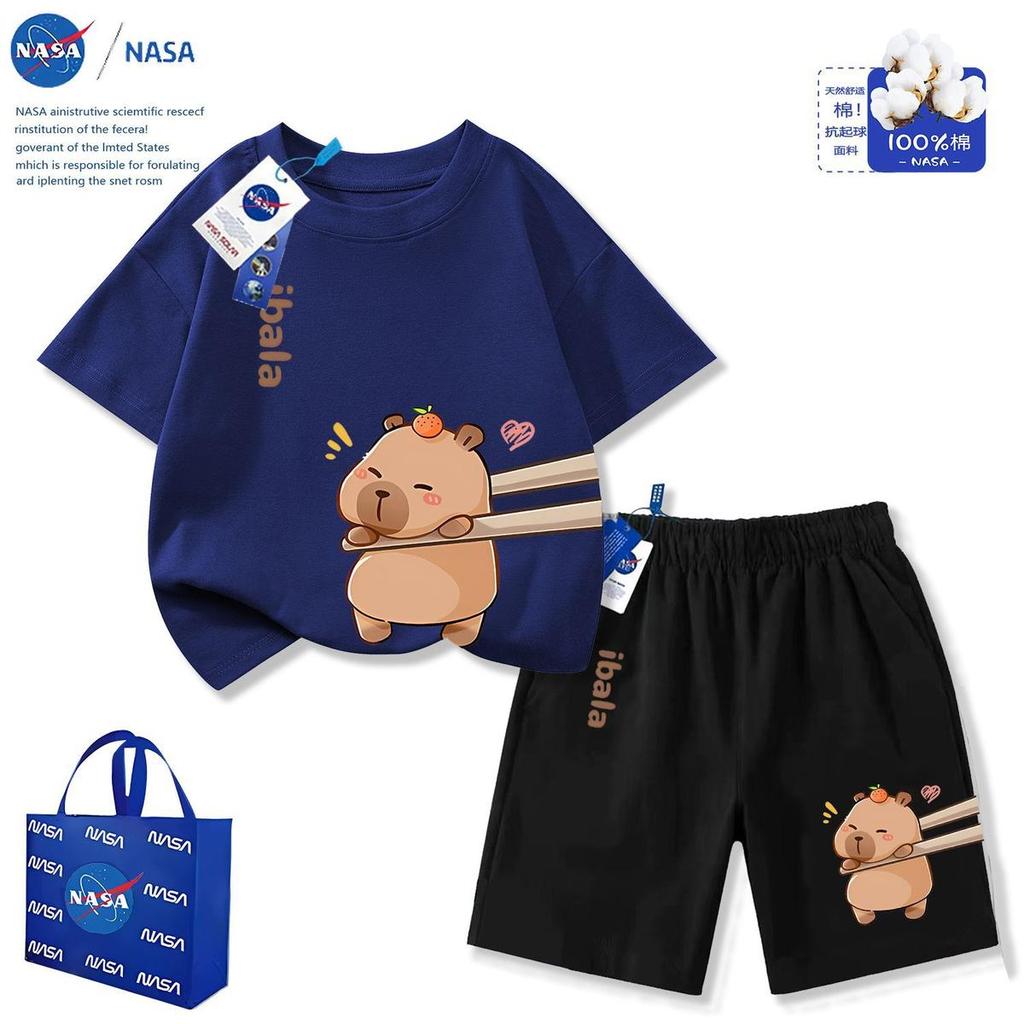 NASA ร่วมแบรนด์ฤดูร้อนปี 2026 กางเกงขาสั้นมัดย้อม Capibara สุดน่ารักใหม่สำหรับเด็กชายและเด็กหญิงชุดกลางและใหญ่