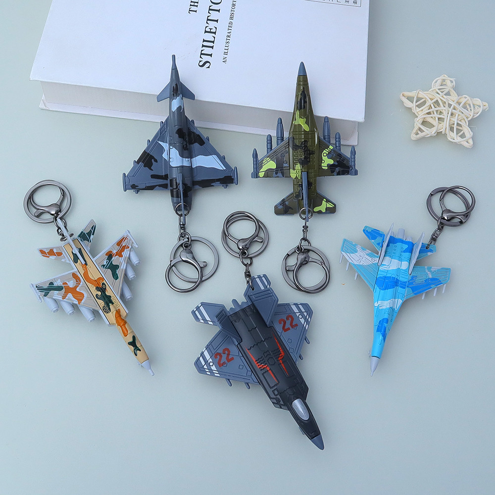 Camouflage Fighter Jet รุ่นพวงกุญแจ Creative 3D เครื่องบินพวงกุญแจทหารพัดลมของขวัญกระเป๋า Decor