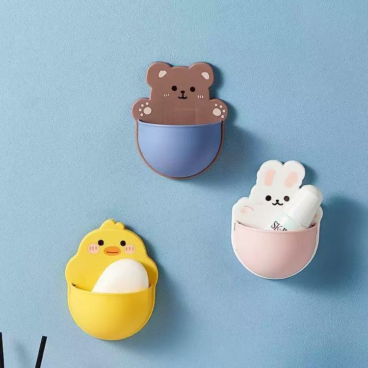 ใหม่น่ารักการ์ตูนชั้นเก็บผนังเจาะฟรีติดผนังออกแบบแปรงสีฟันรีโมทคอนโทรลกล่องเก็บข้างเตียง