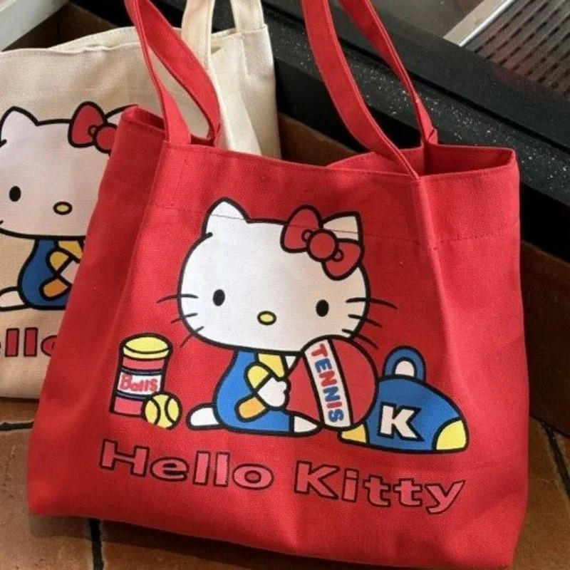 กระเป๋าผ้าใบ Sanrio Hello Kitty กระเป๋าสะพายความจุขนาดใหญ่น่ารักการ์ตูน Tote Bag กระเป๋าถือสําหรับ Commuting ภายนอกของขวัญสําหรับเด็กผู้หญิง