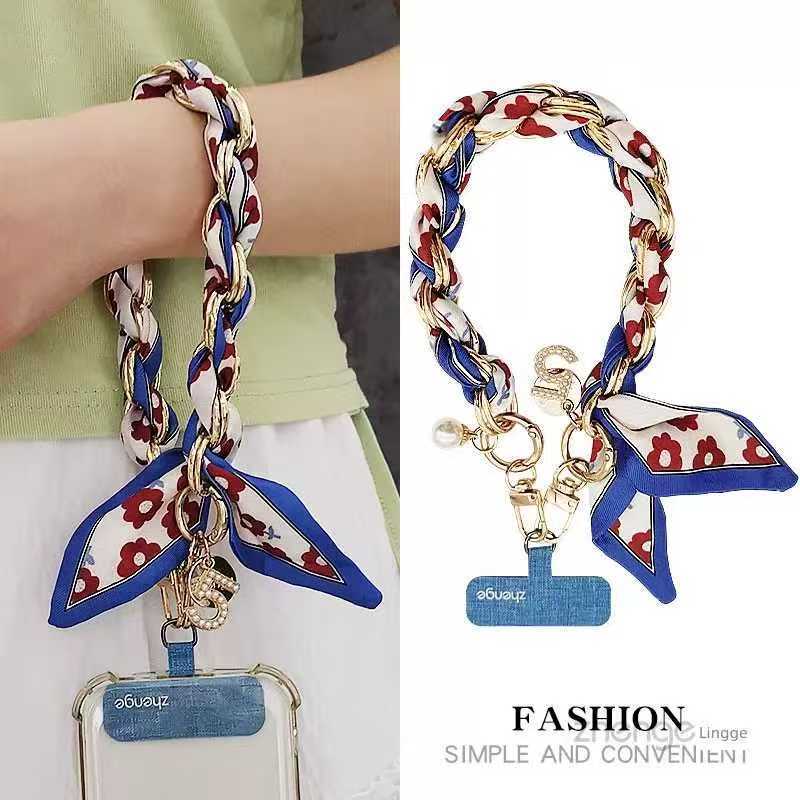 สายรัดข้อมือโทรศัพท์สําหรับผู้หญิงสาวแฟชั่น อิน สไตล์ระดับไฮเอนด์กลิ่นหอมขนาดเล็กลมผ้าไหมผ้าพันคอสายรัดข้อมืออุปกรณ์สร้างสรรค