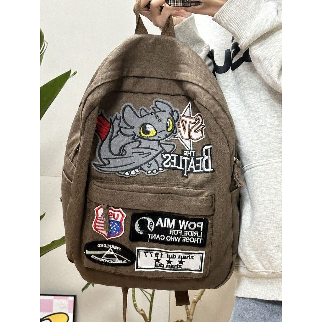 กระเป๋าเป้สะพายหลังมอนสเตอร์ก็อดซิลล่าสไตล์อเมริกันเรโทรแบบ DIY ใหม่ ดีไซน์ผ้าจับจีบและสไตล์ฮิปฮอปสุดอินเทรนด์