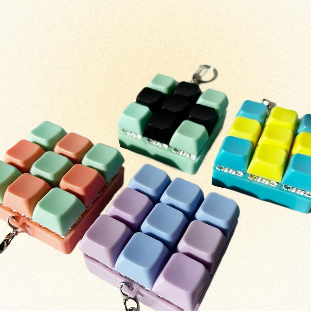 Macaron สี 9key คีย์บอร์ดของเล่น Diy ปุ่ม Keycap Sensory Fidget พวงกุญแจของเล่นบีบอัด P5d9