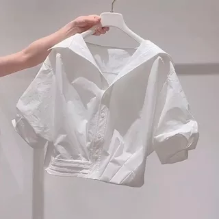 เสื้อเชิ้ตแขนสั้นสีน้ำเงินสไตล์ฝรั่งเศสที่หวานละมุนและสง่างามสำหรับผู้หญิงในฤดูร้อน2026เสื้อเชิ้ตแขนสั้นดีไซน์ใหม่ที่ทัน