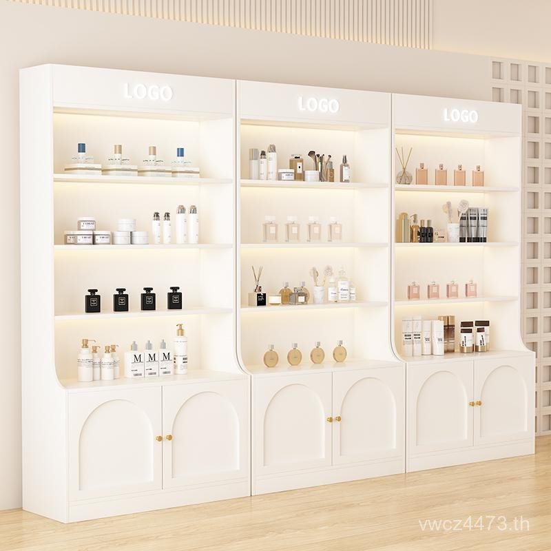 ชั้นวางประตูกระจกเครื่องสําอางหลายชั้นผลิตภัณฑ์ผลิตภัณฑ์ดูแลผิวเล็บตู้แสดงร้านเสริมสวยความงามชั้นวาง