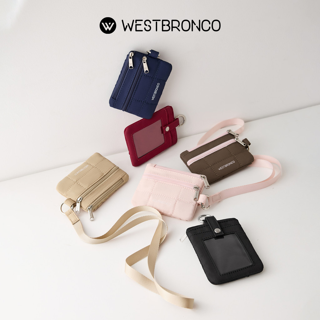 WESTBRONCO  รุ่นชิฟฟ่อน (Chiffon) – กระเป๋า Card Holder เป็นกระเป๋าสตางค์แบบคล้องมือสำหรับผู้หญิง ผลิตจากไนลอนลายควิลท์ และมีระบบป้องกันการสแกนRFID ที่มาพร้อมช่องซิป 2 ช่อง มีสายคล้องคอ และช่องใส่บัตร