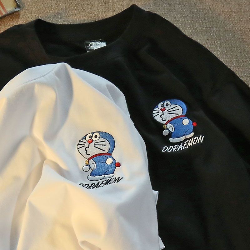 CODACE BEAUTY ผ้าฝ้าย 100% เสื้อยืดแขนสั้น Unisex Doraemon การ์ตูนพิมพ์ผู้หญิงและผู้ชาย Baggy คอรอบค