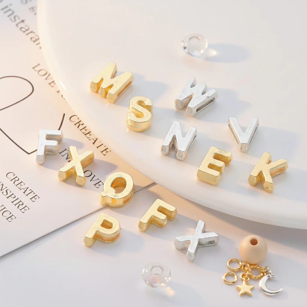 St.kunkka 10-20g ลูกปัดตัวอักษร ABS สีทอง/เงิน รูแบน อะไหล่ตัวอักษร A-Z สำหรับทำสร้อยข้อมือชื่อ DIY งานฝีมือ