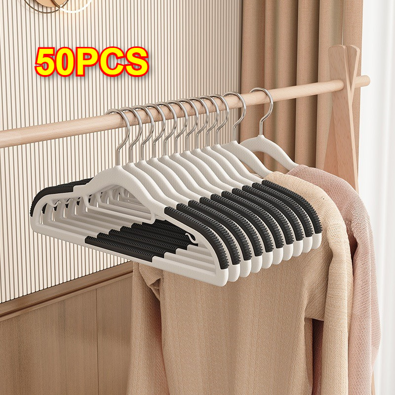 50PCS ไม้แขวนผ้า ไมแขวนเสื้อ ไม้แขวน ไม้แขวนเสื้อพลาสติก ไม้เเขวนขอบกันลื่น ไม้แขวนเสื้อไร้รอยต่อ ราวหนีบผ้า