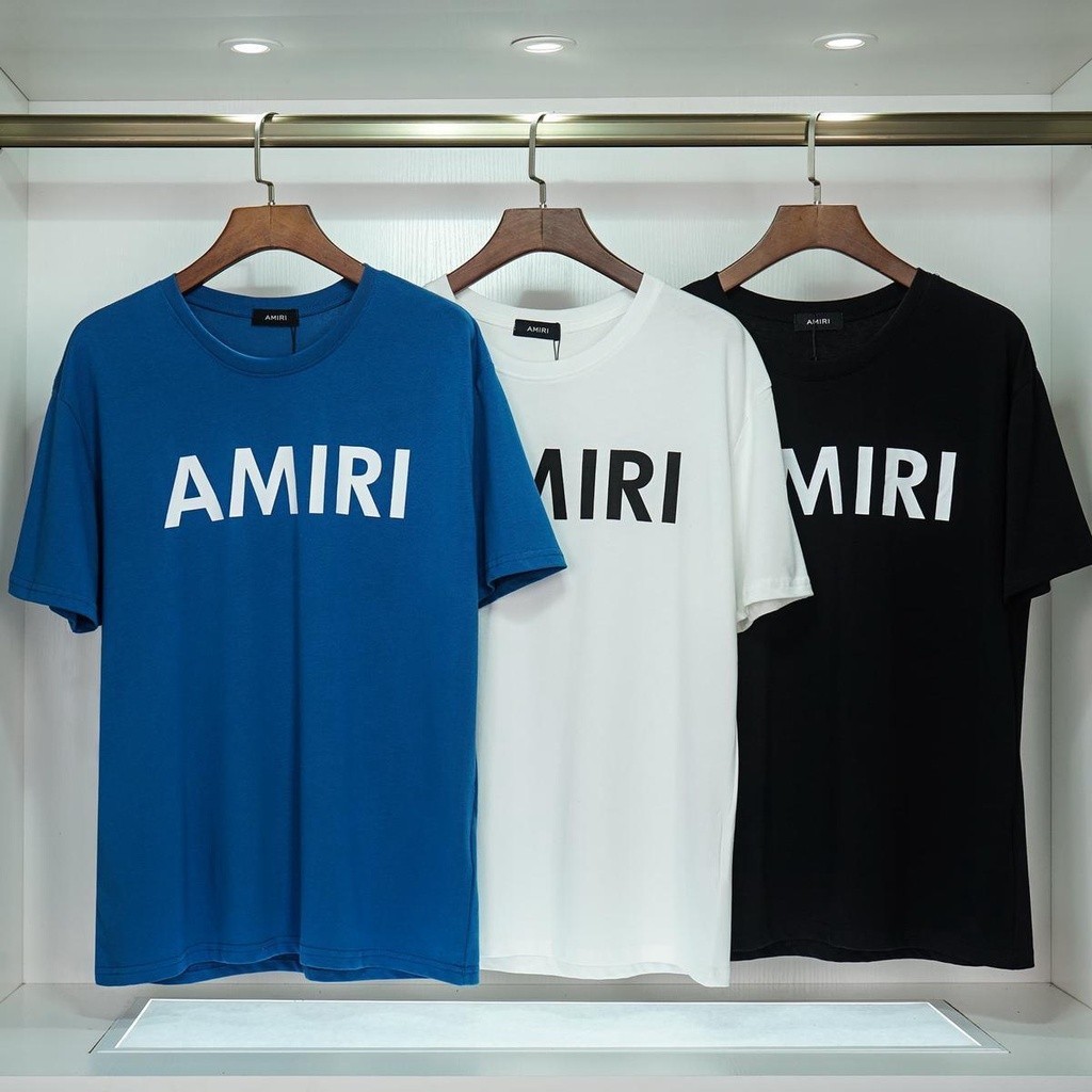 Amiri 2023 ใหม่ เสื้อยืดแขนสั้นลําลอง พิมพ์ลายตัวอักษร เรียบง่าย สําหรับผู้ชาย และผู้หญิง