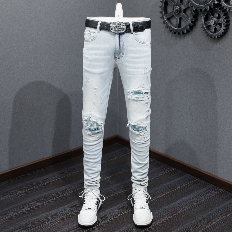 Amiri สตรีทแฟชั่นผู้ชายกางเกงยีนส์ Vintage Light Blue Slim Sky Blue Patch ออกแบบฝีมือกางเกงยีนส์ผู้
