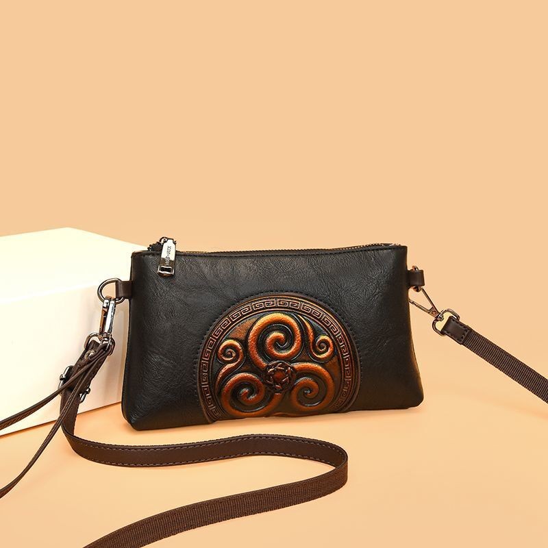 [ป่าสีเขียว] คลัทช์หนังแท้ แบบชาติพันธุ์นูน เหมาะสำหรับวัยทำงานและโอกาสสำคัญ 2025 ใหม่