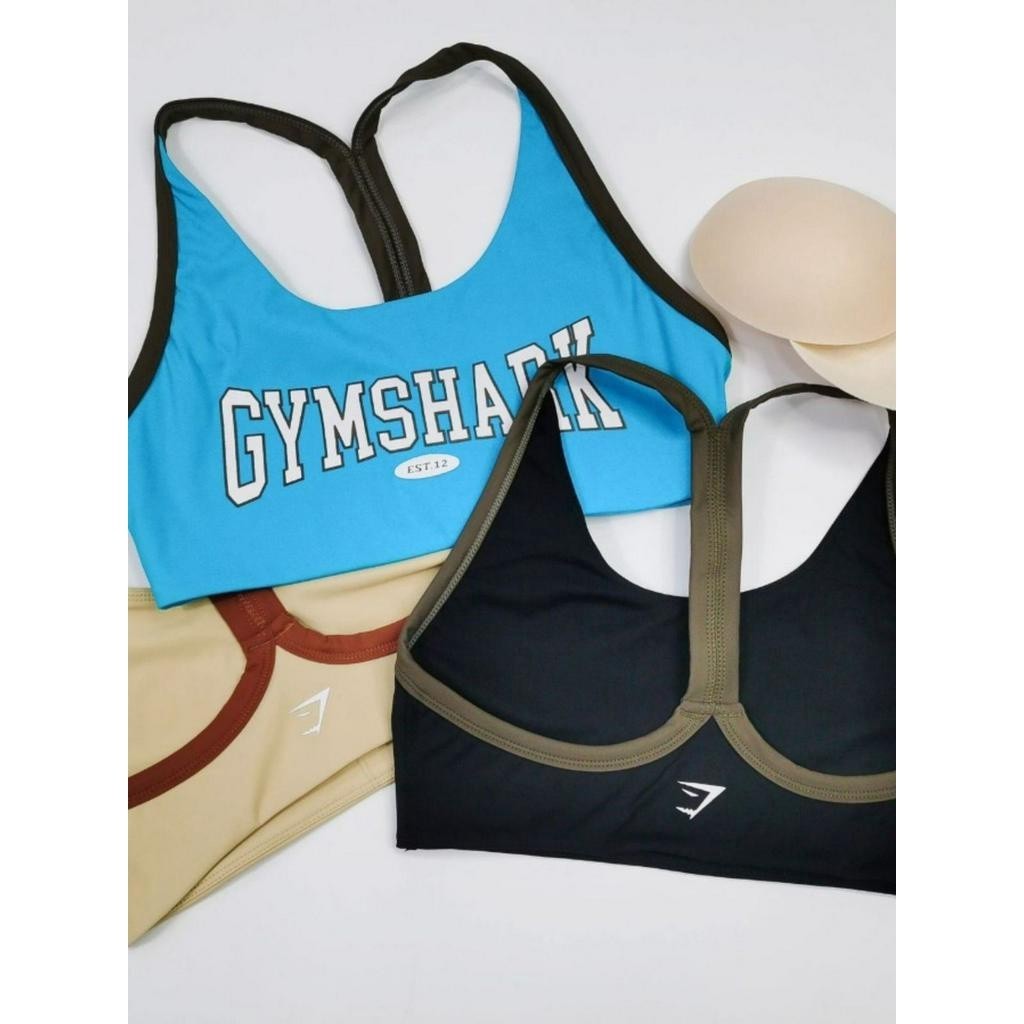 Gymshark ชุดชั้นในออกกําลังกายโยคะสีตัดกันความเข้มสูงปานกลางแห้งเร็วพร้อมแผ่นรองหน้าอกชุดชั้นในกีฬ