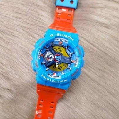 Casio G-SHOCK GA-110NC-2AJF สายสีส้มตัวอักษรสีน้ําเงินและกรอบรูปนาฬิกาสปอร์ต Unisex นาฬิกาสปอร์ตกัน