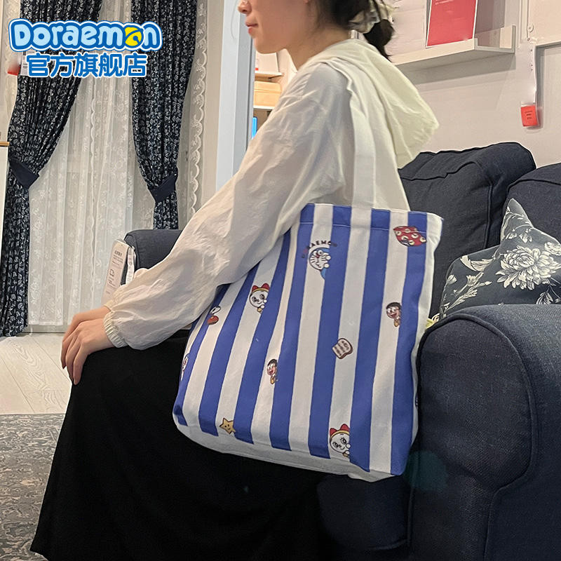 Doraemon Flagship Store ขนาดใหญ่-ความจุเป็นมิตรกับสิ่งแวดล้อมกระเป๋า Peekaboo สไตล์ผ้าใบนักเรียน Commuter Shou